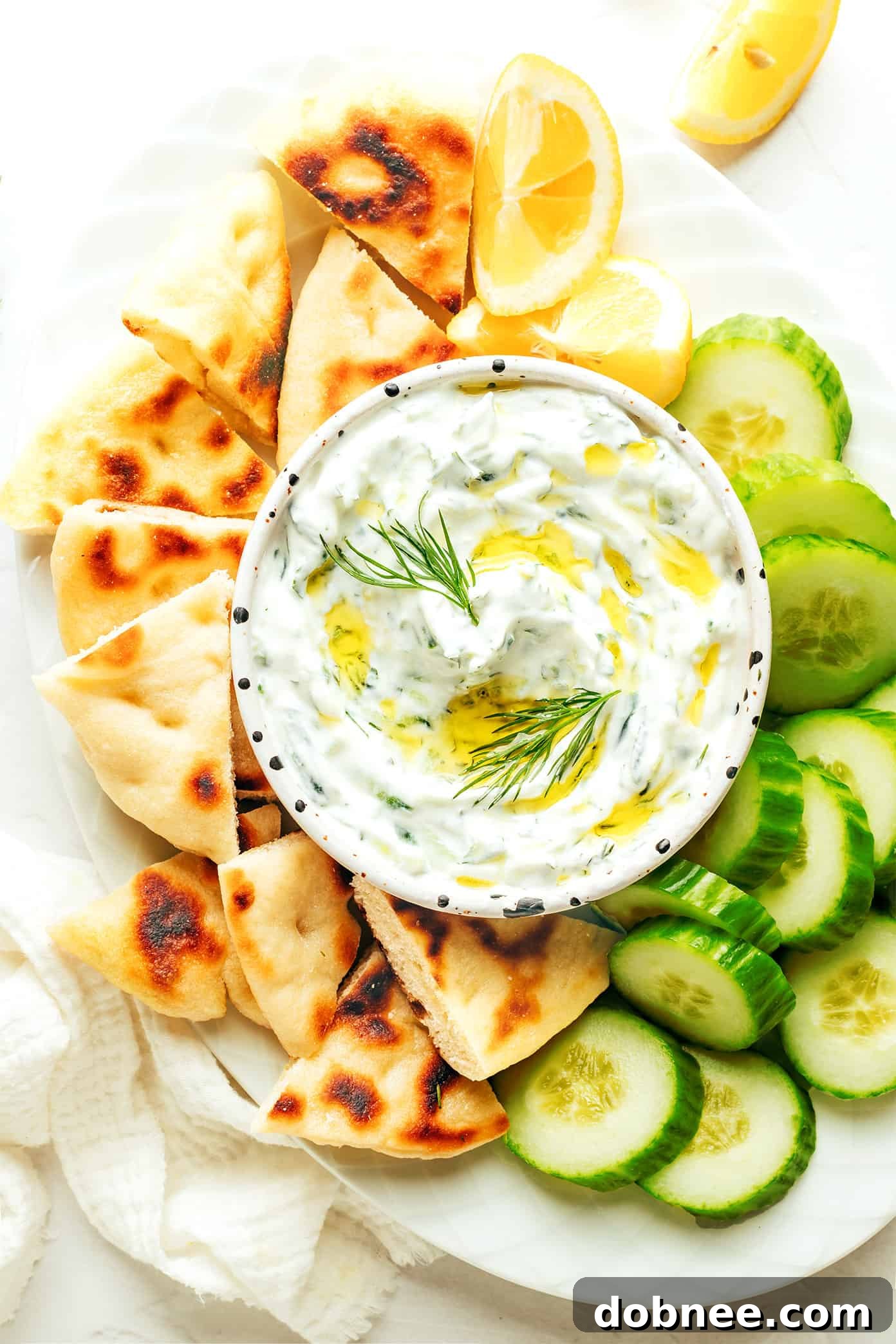 Refreshing Cucumber Yogurt Dip 7 A selection of fresh herbs, including dill and mint, essential for infusing Tzatziki with its distinctive aromatic profile.
