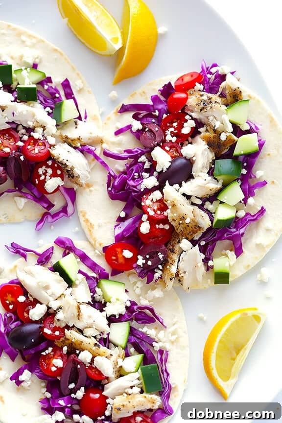 Delicious Greek Fish Tacos with fresh ingredients and homemade tzatziki sauce.