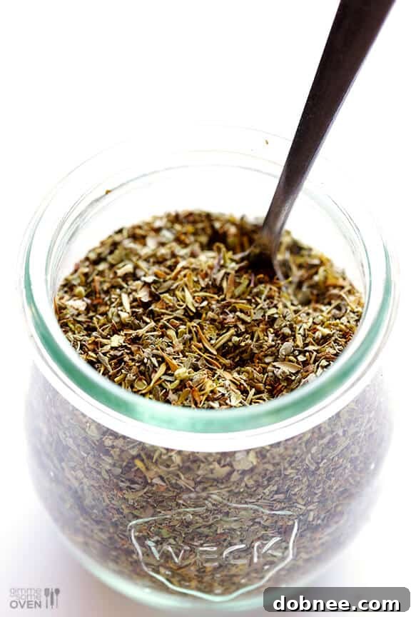 Fresh Homemade Italian Seasoning A jar of homemade Italian seasoning, ready for use in a rustic kitchen setting. The image emphasizes freshness and simplicity.