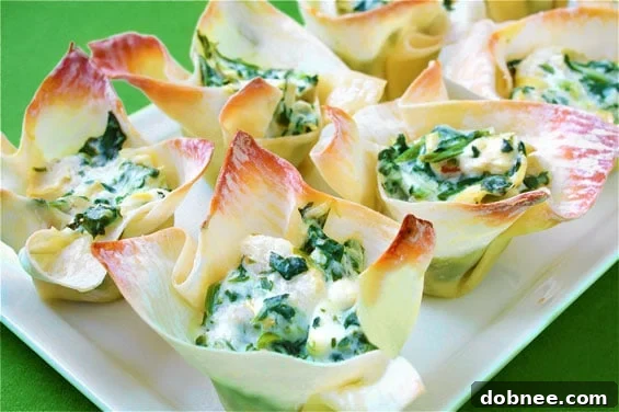 Delicious Spinach & Artichoke Wonton Cups on a serving platter, perfect for parties