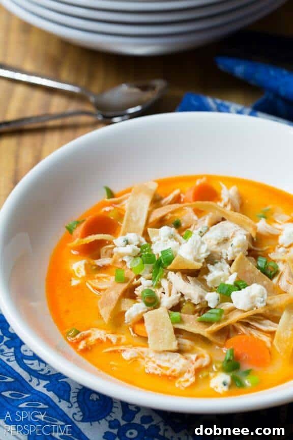 Spicy Slow Cooker Buffalo Chicken Soup with blue cheese crumbles