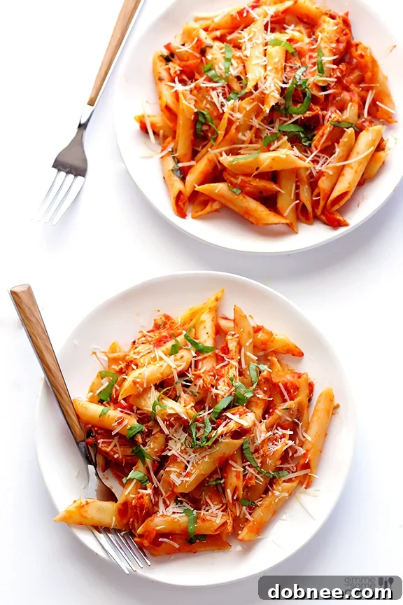 Oven-baked Chicken Parmesan Ziti, bubbling with cheese.