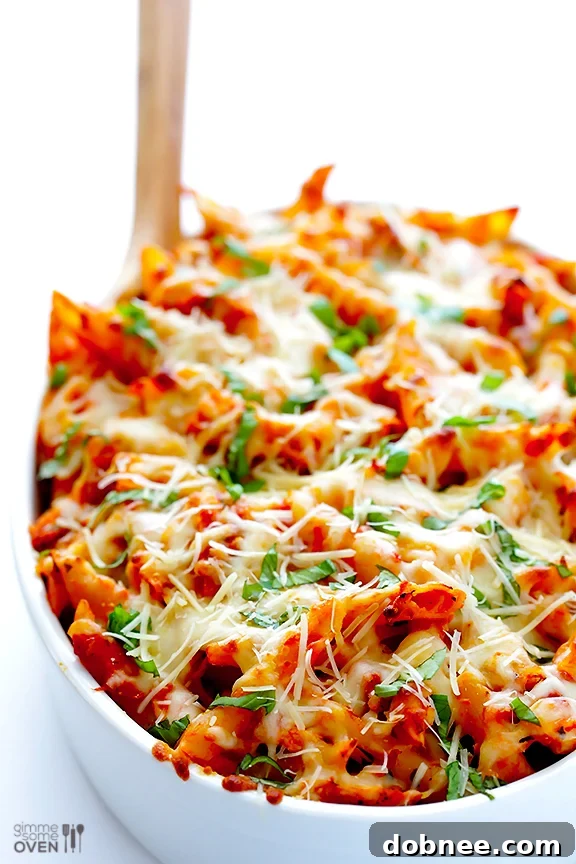 A generous serving of Chicken Parmesan Baked Ziti on a dinner plate.