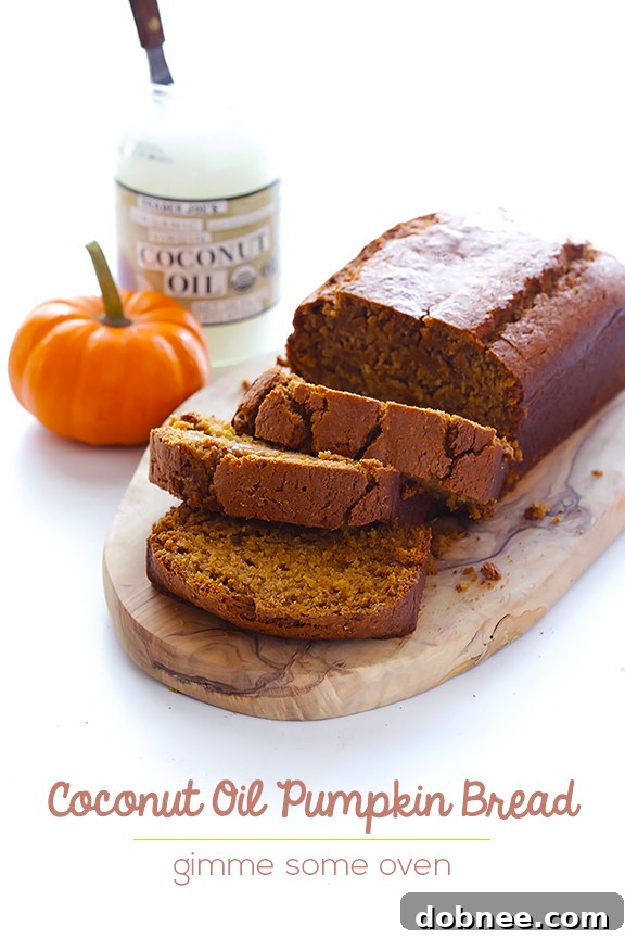 Close-up of a slice of incredibly moist Coconut Oil Pumpkin Bread ready for enjoyment