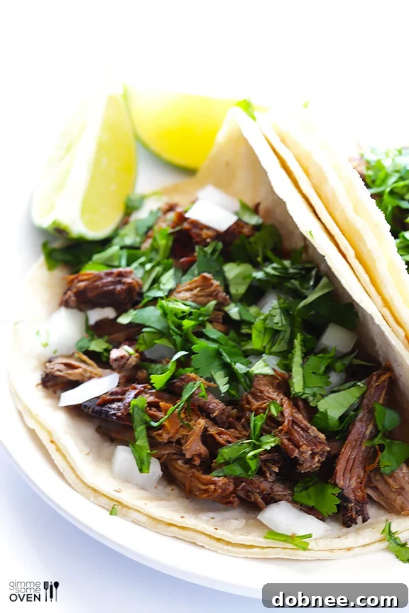 Delicious, tender barbacoa beef ready to be shredded from the slow cooker.