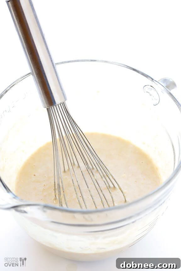 Guiltless Chocolate Chip Pancakes: A close-up of light and fluffy pancakes studded with mini chocolate chips, ready for a healthy breakfast.