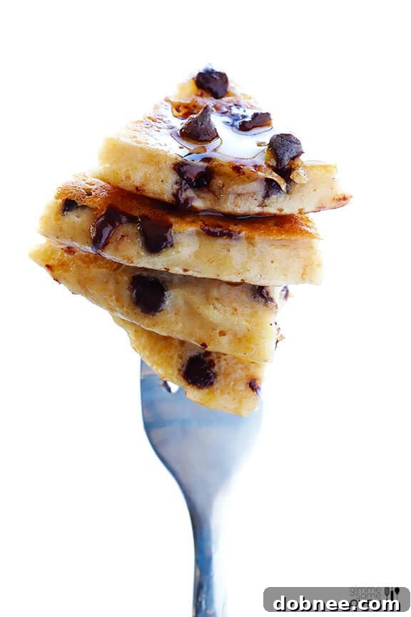 Guiltless Chocolate Chip Pancakes: A stack of healthy chocolate chip pancakes, topped with extra chocolate chips and a drizzle of syrup, for a perfect breakfast.