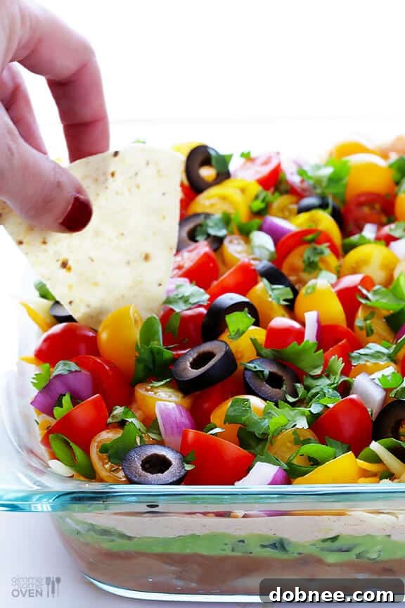 Vibrant and fresh 7 Layer Dip, an irresistible classic appetizer perfect for game day gatherings and parties.