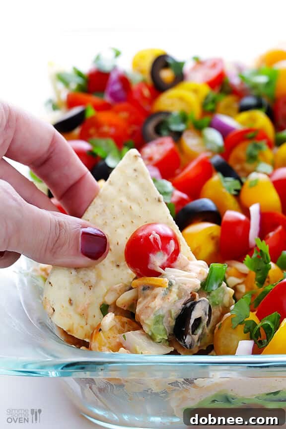 Appetizing close-up of a perfectly layered 7 Layer Dip, vibrant and ready to serve.