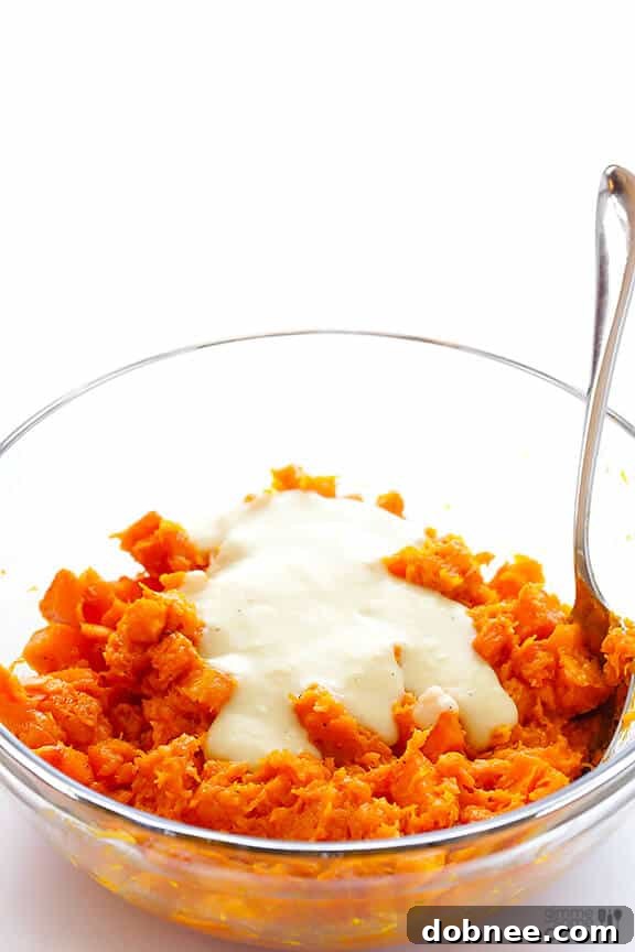 Roasted butternut squash and garlic cloves, forming the base for the creamy filling.