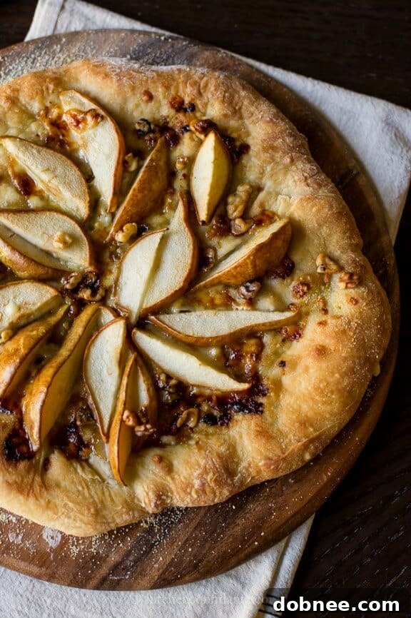 Pear & Walnut Gorgonzola Pizza, a sophisticated and nutty fall pizza choice.