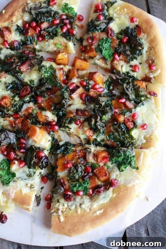 Caramelized Butternut, Crispy Kale & Fontina Pizza with Pomegranate Salsa, a vibrant and flavorful seasonal pizza.