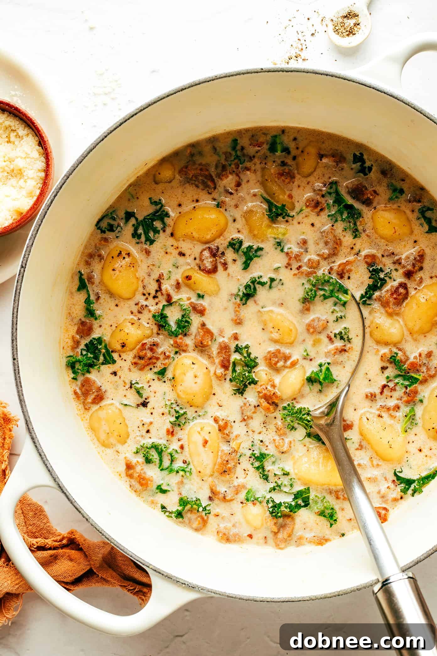 A large pot filled with Easy Gnocchi Zuppa Toscana, simmering to perfection with tender gnocchi and vibrant kale.
