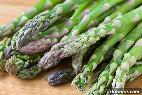 Freshly cooked Gnocchi with Shrimp, Asparagus & Pesto, garnished with Parmesan