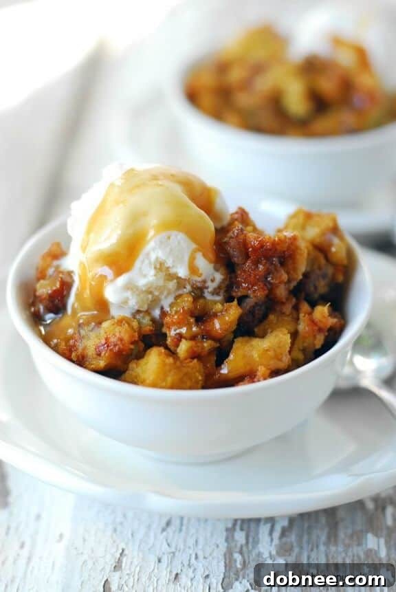 Warm Slow Cooker Pumpkin Pecan Bread Pudding with a rich sauce