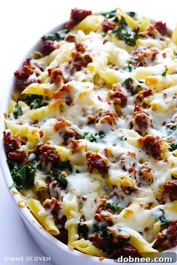 Layering baked ziti with mozzarella cheese