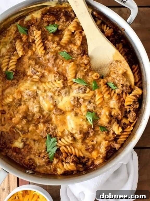 A hearty and comforting bowl of homemade cheeseburger macaroni, brimming with ground beef and melted cheese.