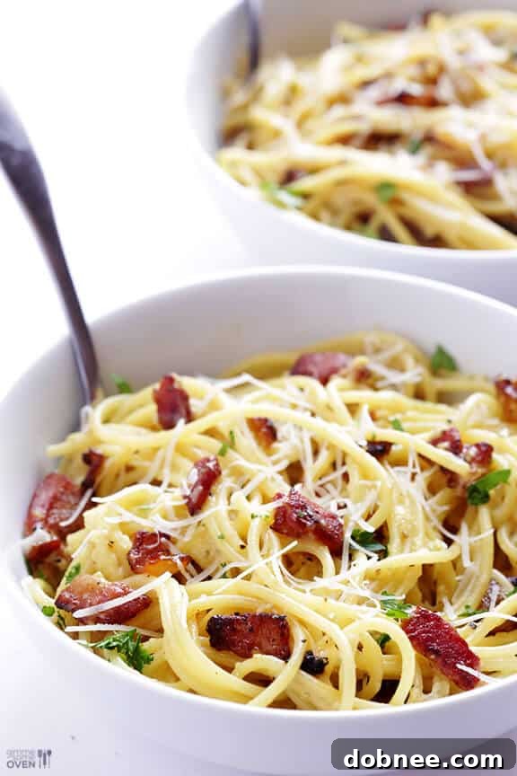 Classic Italian spaghetti carbonara, featuring al dente pasta, crispy pancetta, and a creamy egg-based sauce.
