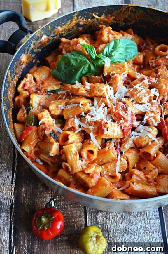 A hearty and robust one-pot spicy chicken riggies dish, rich with tomato sauce and bell peppers.