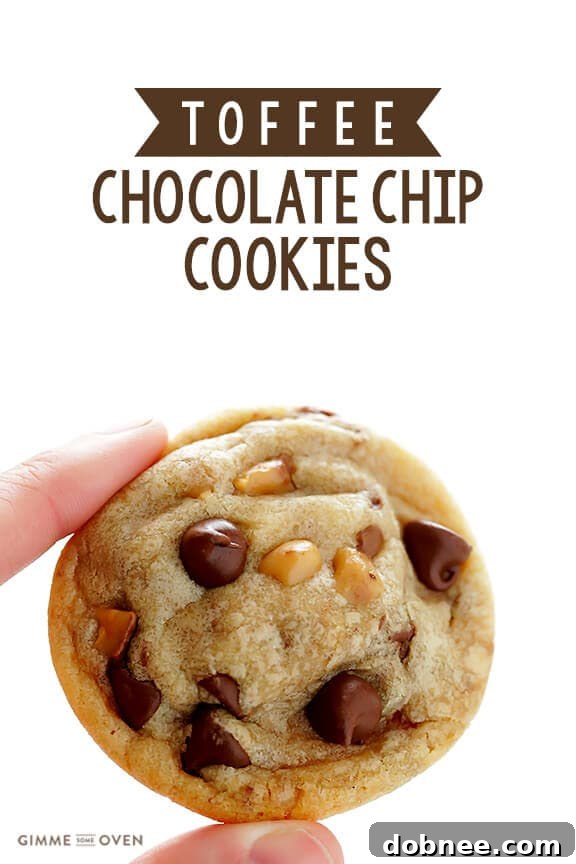 A close-up shot of a single Toffee Chocolate Chip Cookie, showcasing its rich texture and delicious toppings.
