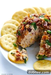 BBQ Bacon Cheese Ball with a serving scooped out.