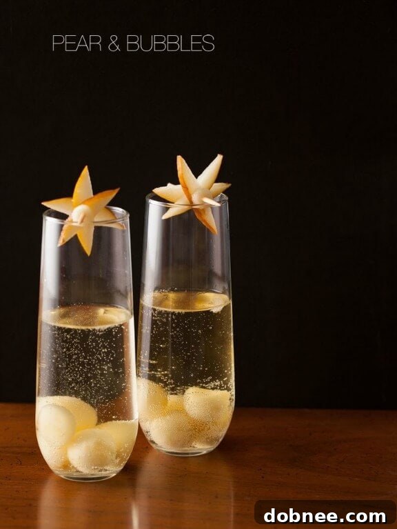 Elegant Pear & Bubbles sparkling cocktail with a pear slice garnish