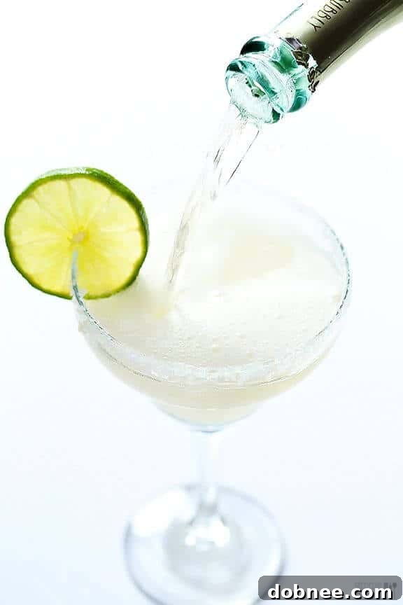 Festive Sparkling Margaritas in salt-rimmed glasses with lime