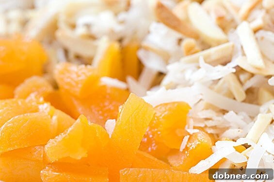 Close-up of a serving of Breakfast Israeli Couscous garnished with fresh mint, showcasing its rich texture and colorful ingredients.