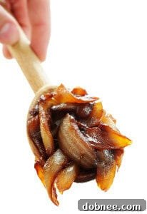 Beautifully golden-brown caramelized onions in a skillet.