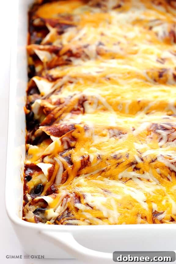 Preparing BBQ Chicken Enchiladas Close-up of BBQ Chicken Enchiladas artfully arranged in a baking dish, generously topped with shredded cheese and ready for the oven