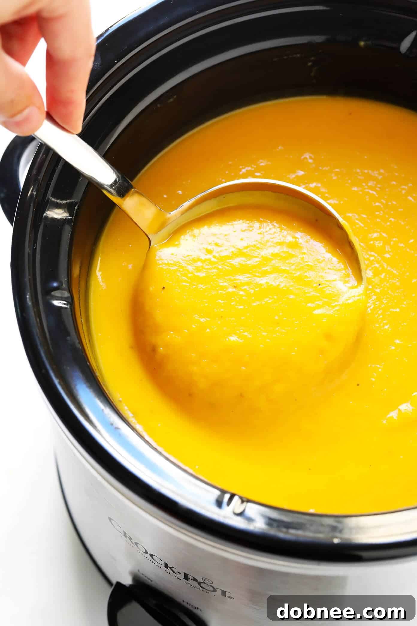 Butternut Squash Soup simmering in a Crock Pot, ready for blending.