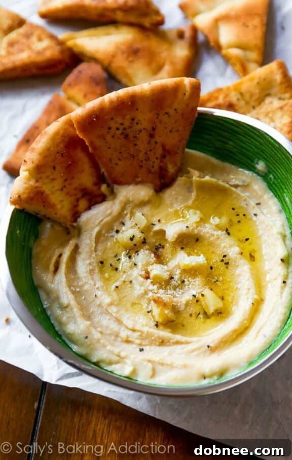 Seriously Smooth Roasted Garlic Parmesan Hummus | sallysbakingaddiction.com