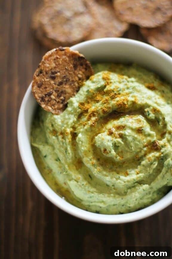 Roasted Garlic Kale Hummus | theroastedroot.net