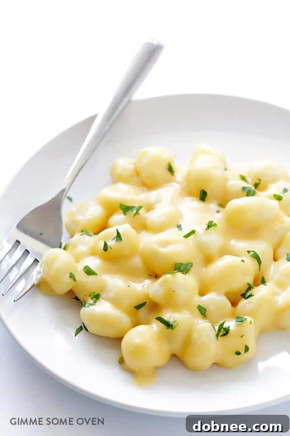 Overhead shot of a bowl of Gnocchi Mac and Cheese with a fork