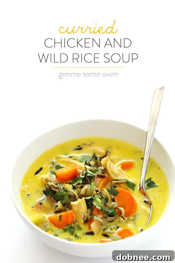 A large pot brimming with hearty Curried Chicken and Wild Rice Soup, signifying a generous and satisfying meal.