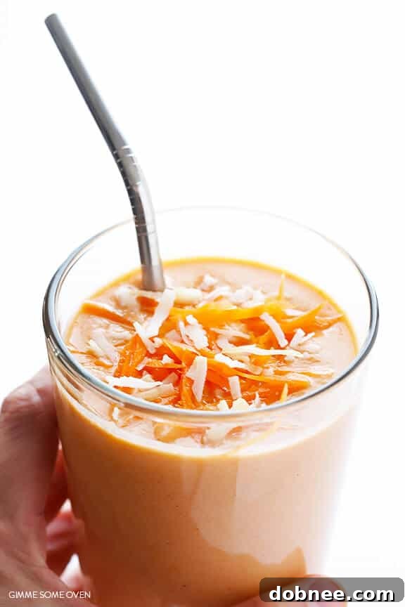 Carrot Cake Smoothie with a serving spoon and a rustic backdrop
