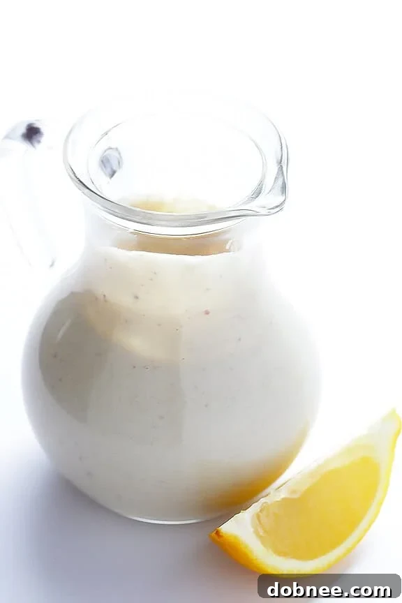 A bowl of fresh Caesar salad with homemade Greek Yogurt Caesar Dressing