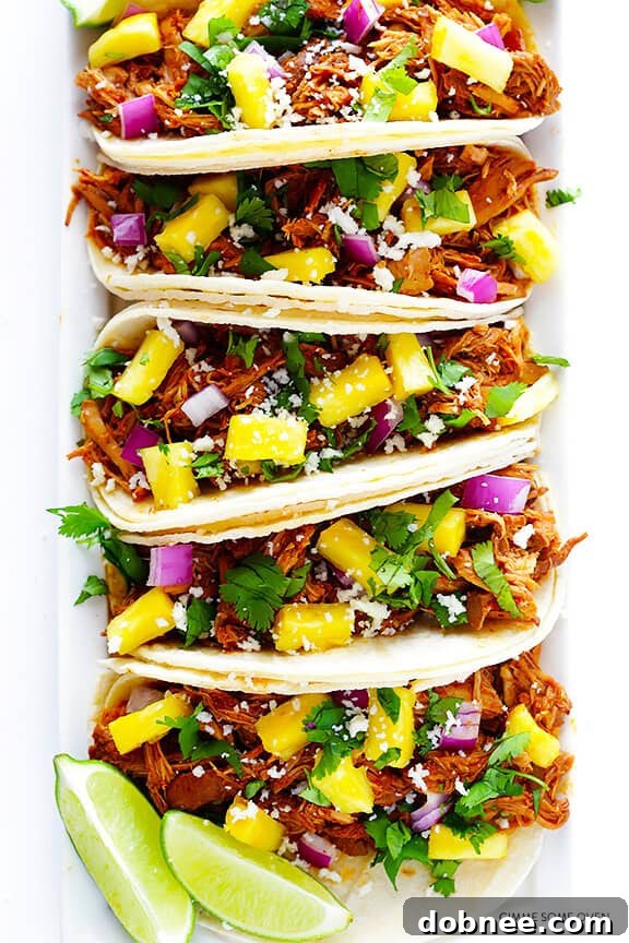 Close-up of Slow Cooker Tacos Al Pastor with fresh pineapple