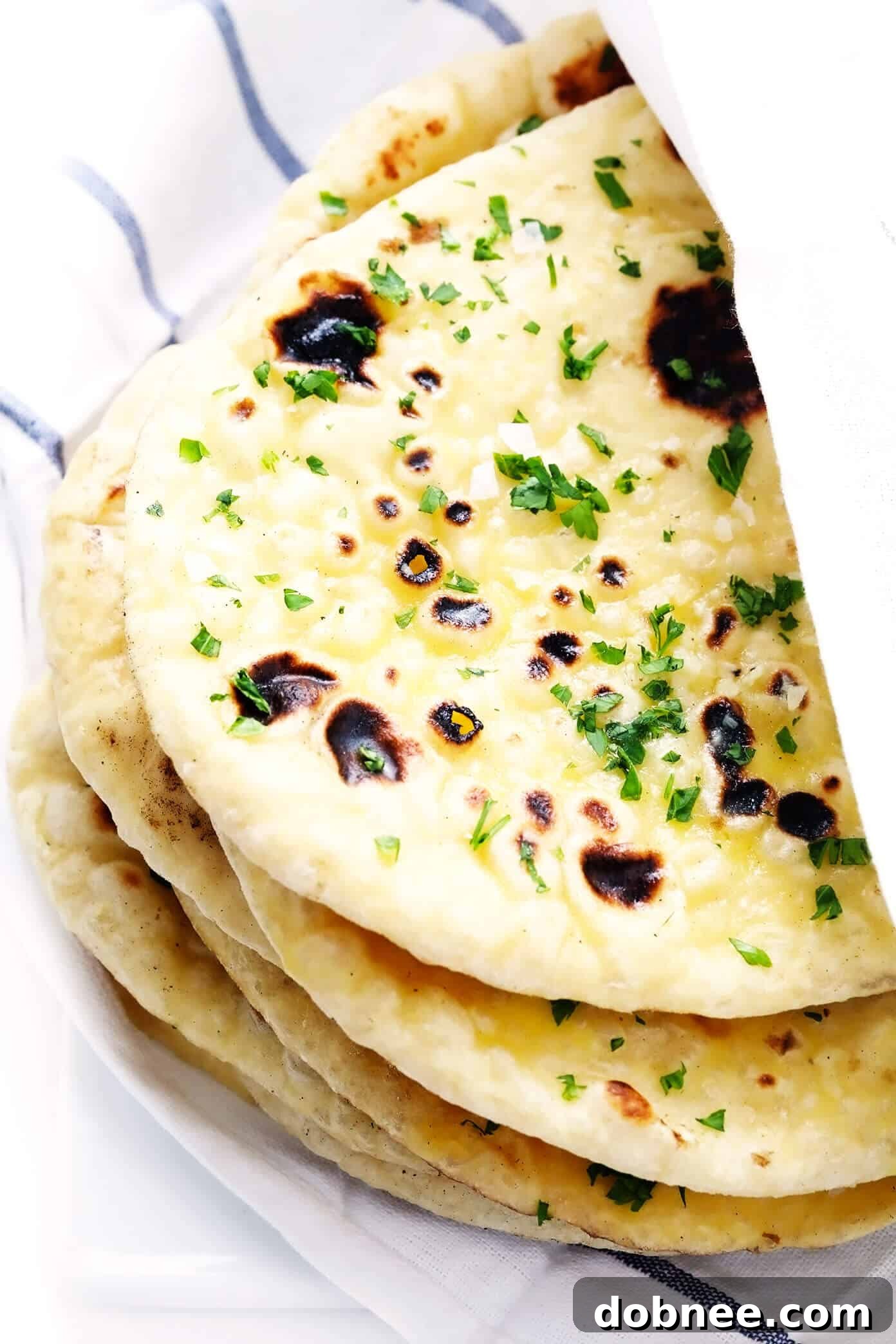 Delicious Homemade Naan Bread with Garlic Butter Drizzle