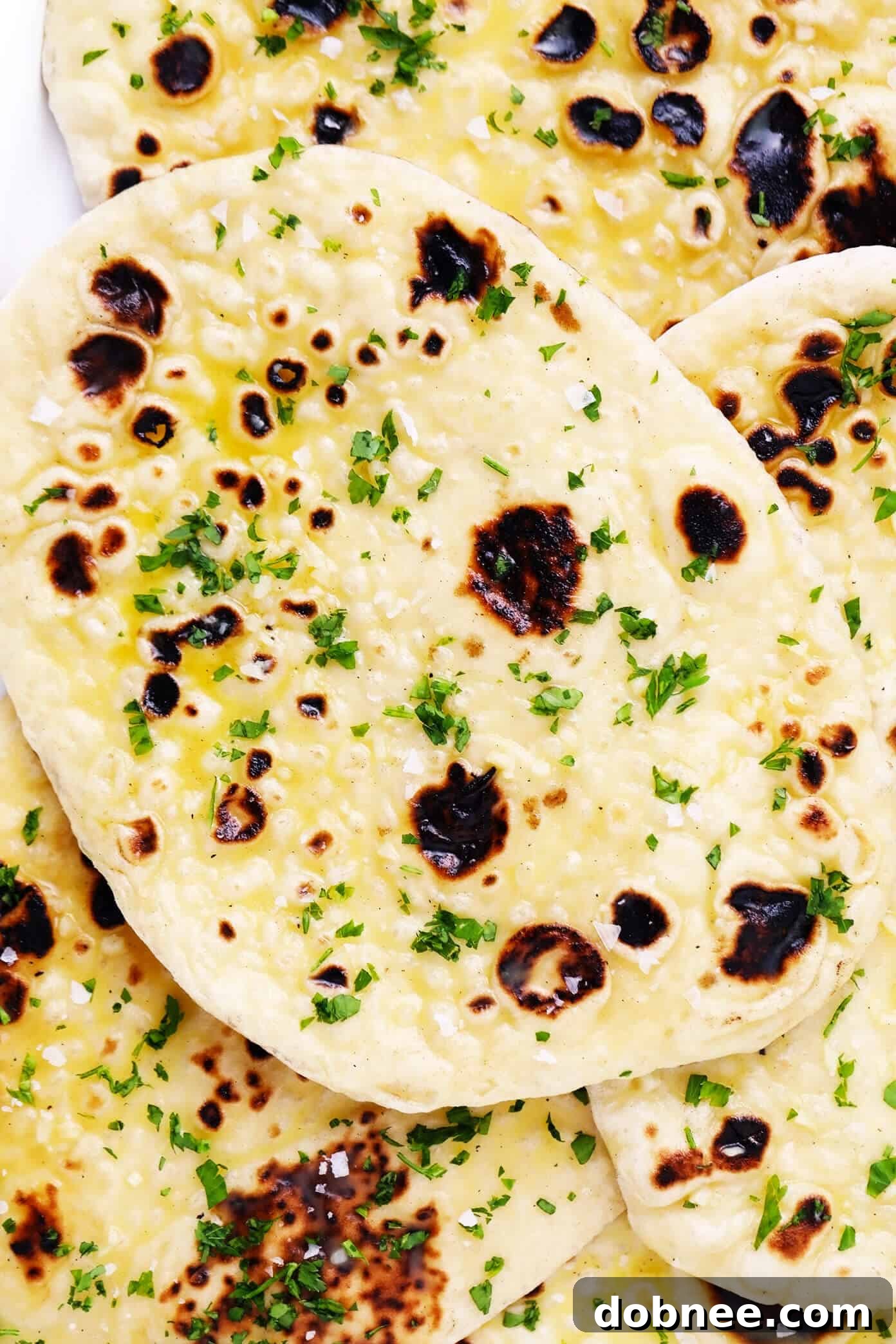Stack of Golden Homemade Garlic Naan Bread