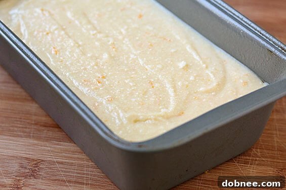 Delicious Orange Ricotta Pound Cake garnished with orange slices and fresh mint