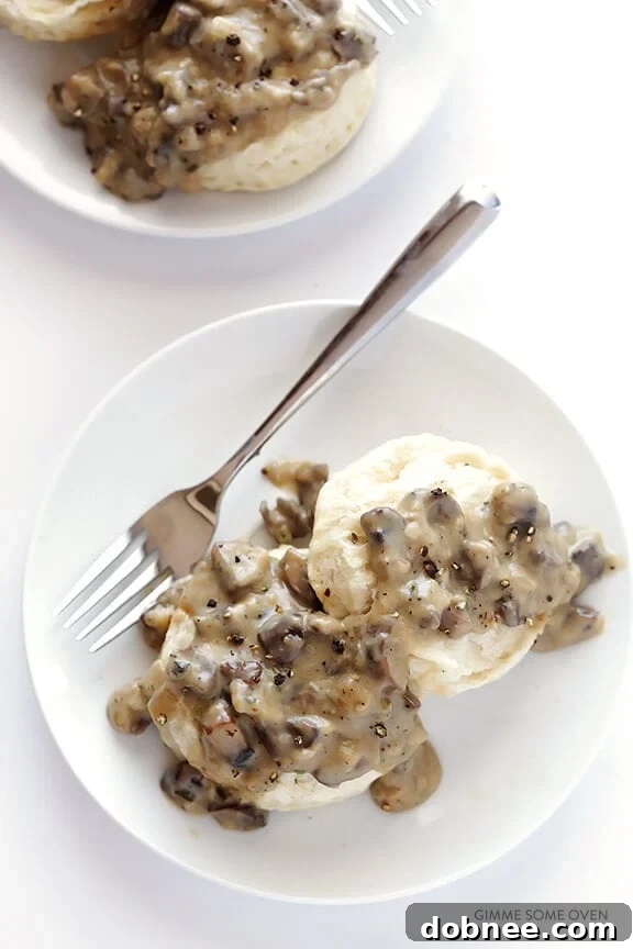 A plate of vegan biscuits and mushroom gravy, ready to be enjoyed.