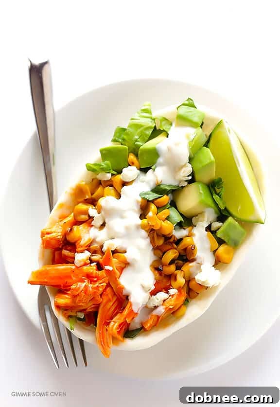 Close-up of a beautifully assembled Buffalo Chicken Taco Bowl, showcasing fresh ingredients and vibrant colors.