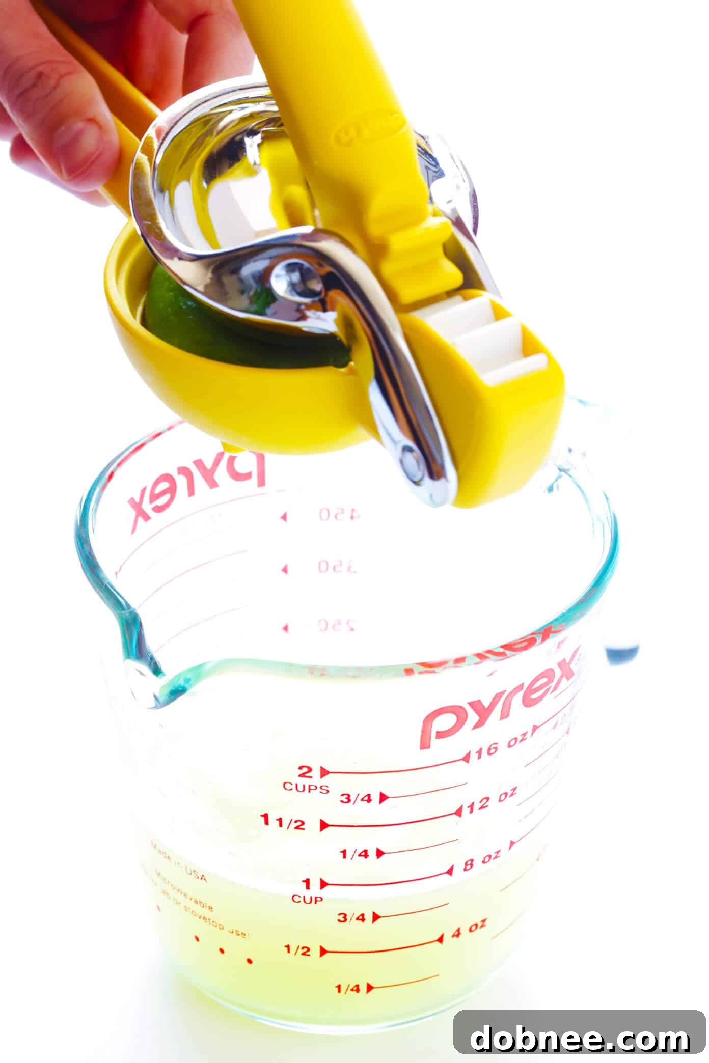 Key Margarita Ingredients for a Perfect Cocktail Fresh Margarita Mix in a Glass Measuring Cup