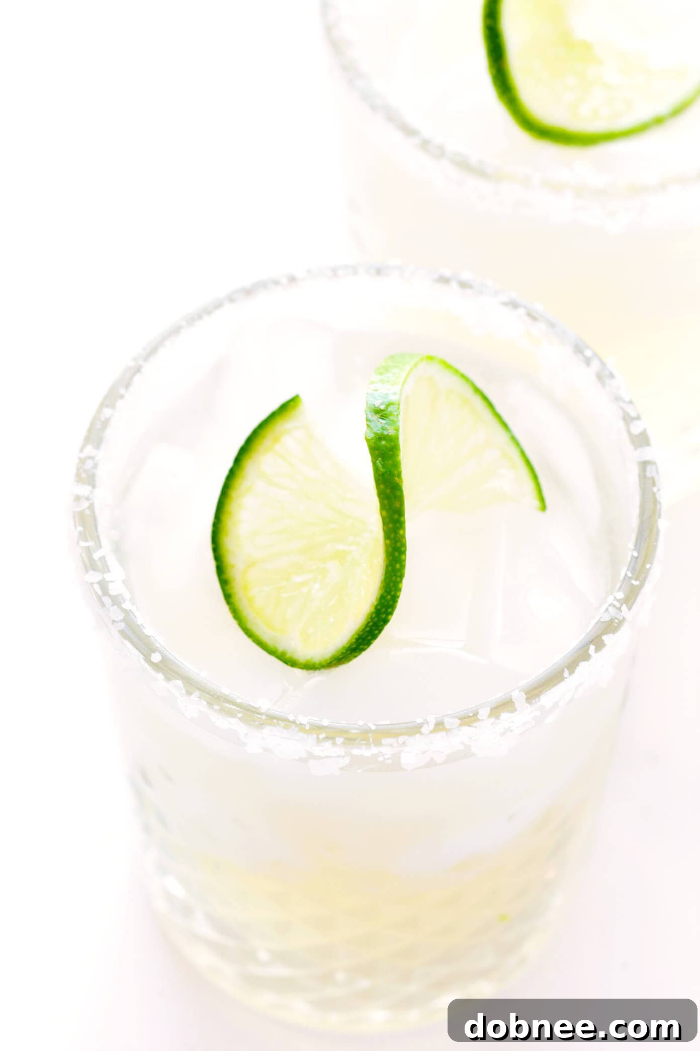 Creative Variations for Your Classic Margarita Classic Margarita Glasses with Salted Rims and Lime