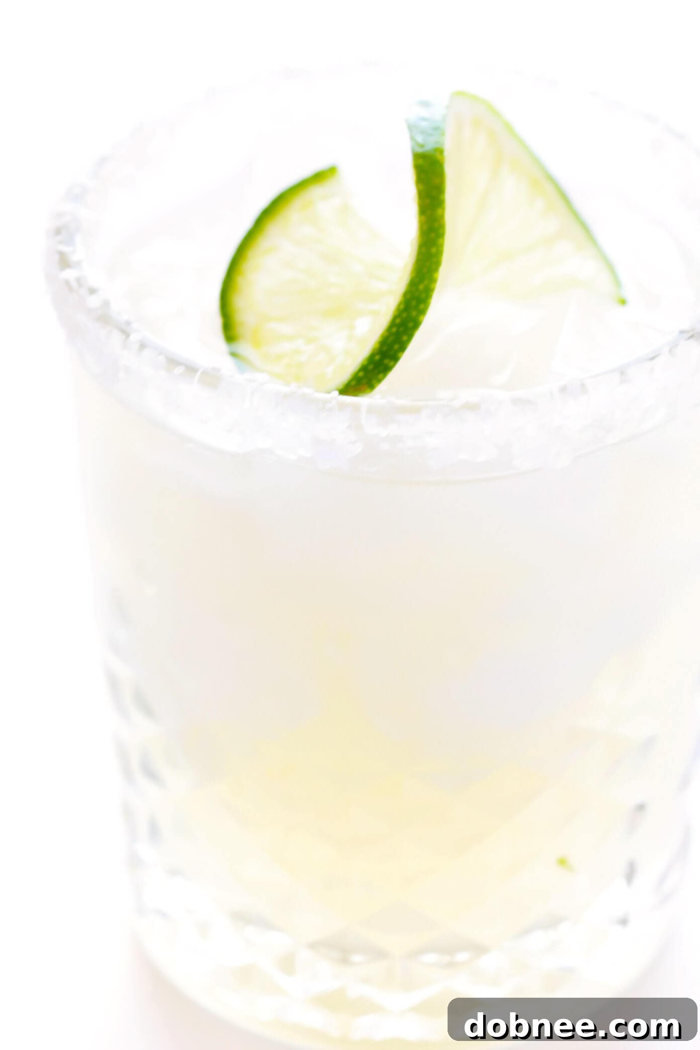 Savoring the Perfect Classic Margarita Perfectly Poured Classic Margarita in a Glass with Lime