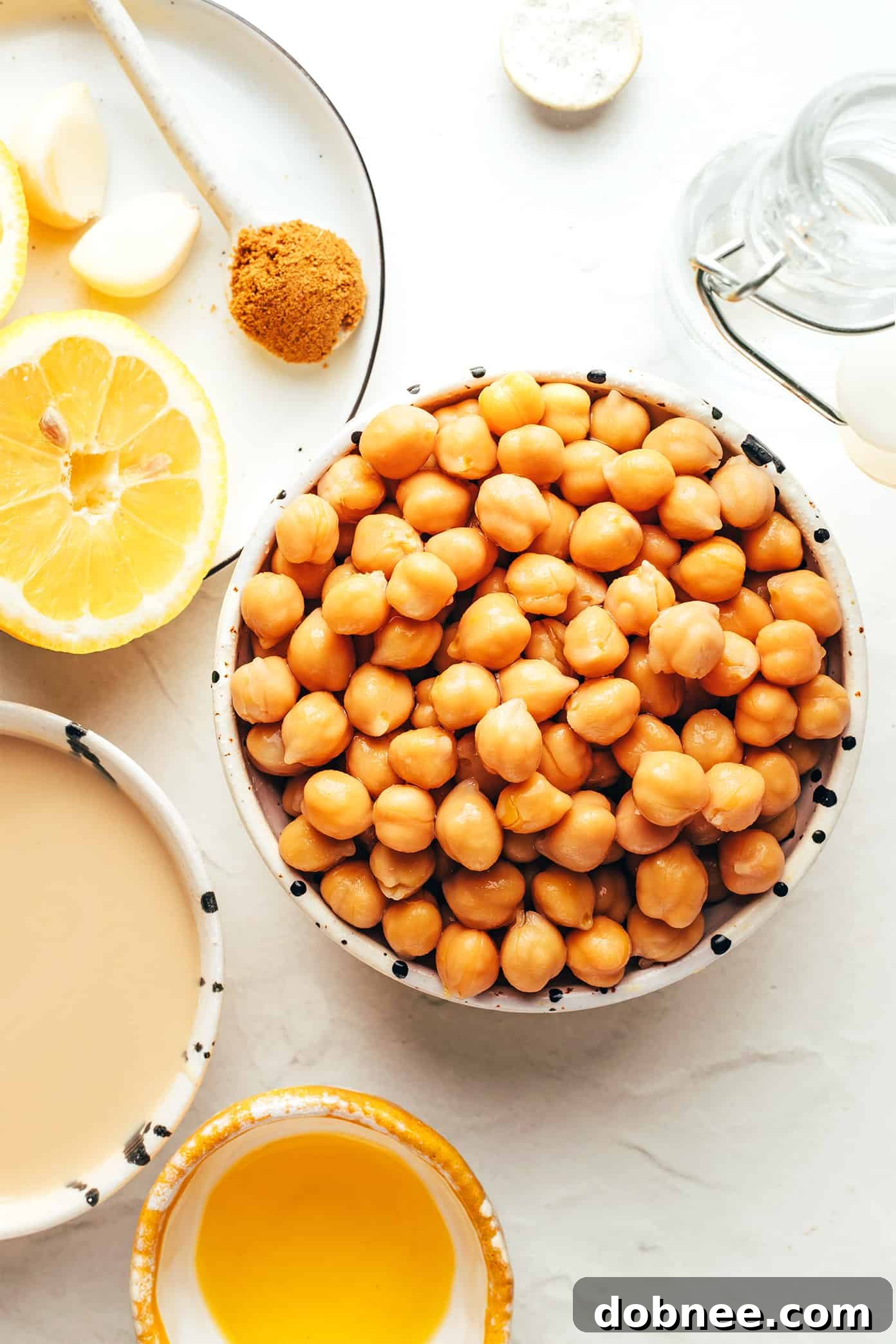 A close-up shot of creamy homemade hummus garnished with olive oil and fresh parsley, ready to be served.