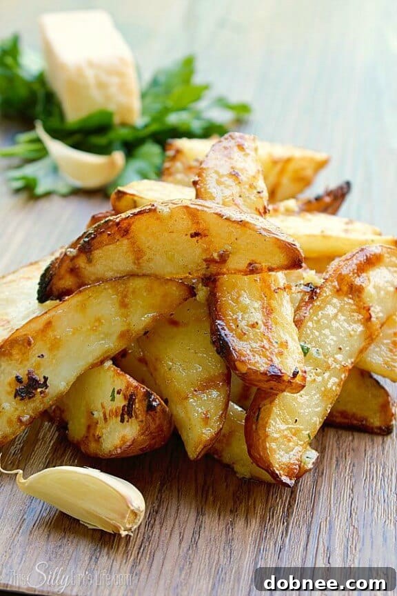 Garlic Parmesan Grilled Potato Wedges, crispy and flavorful side dish.