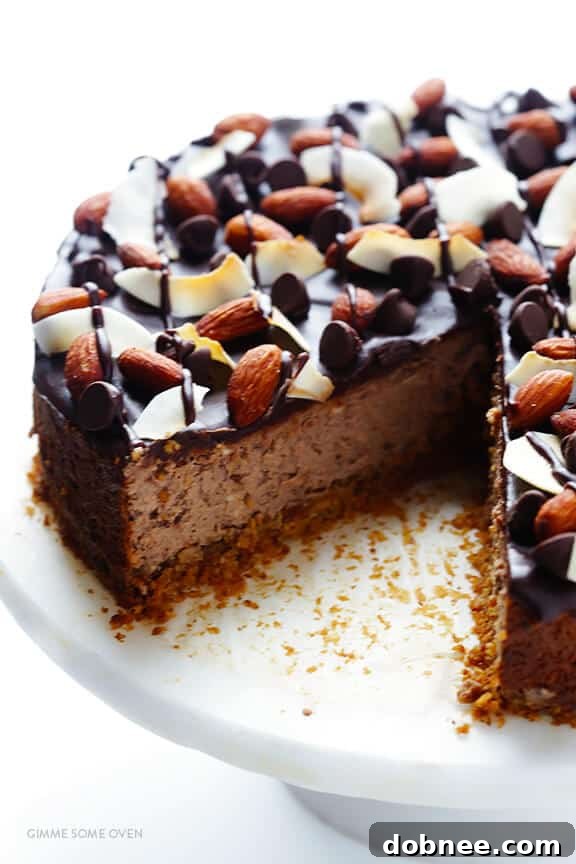 A single slice of Almond Joy Cheesecake, ready to be enjoyed.