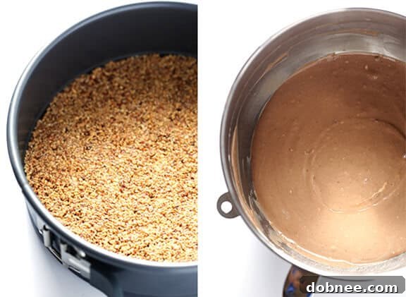 The almond crust mixture pressed into a springform pan, ready for baking.